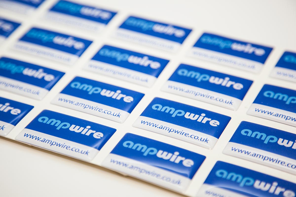 sheet of blue and white domed labels