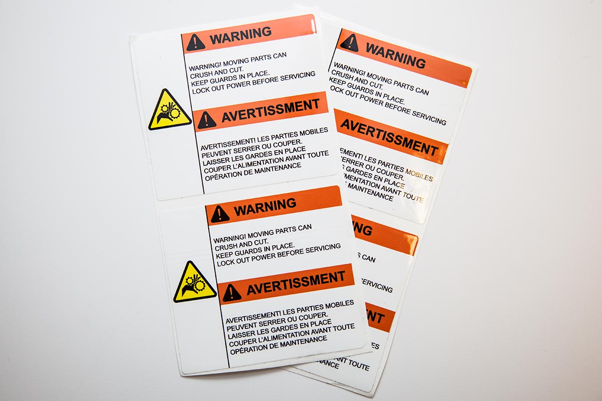 two sheets of colour laminated warning labels