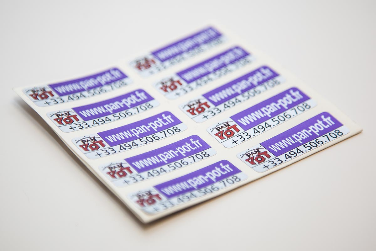sheet of colourful warranty contact information labels